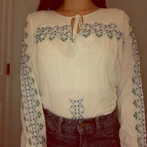 White blouse with flower detail